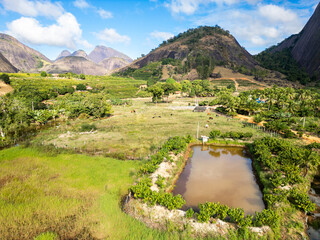 Aerial drone view of a rural property in Aguia Branca, Epirito Santo, Brazil, with artificial lake...
