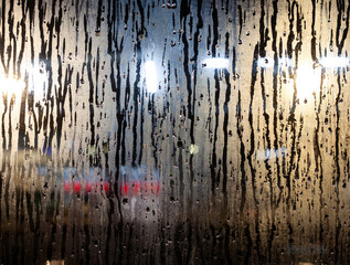 Rain drops flowing on the window