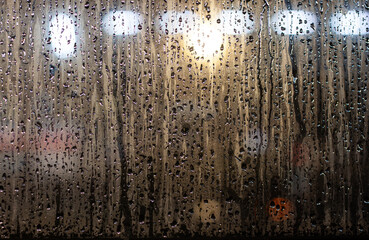Rain drops flowing on the window