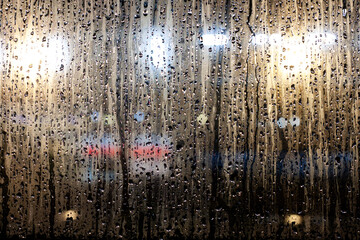 Rain drops flowing on the window