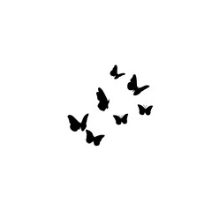 Flying butterflies silhouettes. Flock of butterflies on white background. Vector design element.
