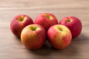 Red apple fruit (Envy apple) on wooden background