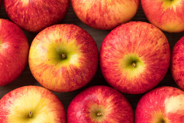 Red apple fruit (Envy apple) texture background, Top view