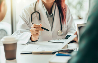 Doctor with Bright Red Hair in White Lab Coat Holding Coffee and Documents, Taking Notes with Black Pen During Interview, Medical Office Atmosphere Emphasizing Professional Communication