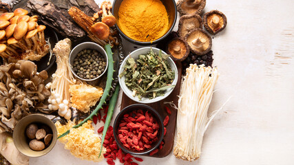 Healthy natural adaptogen. Herbs, spices, mushrooms on light background. Nervine food collection