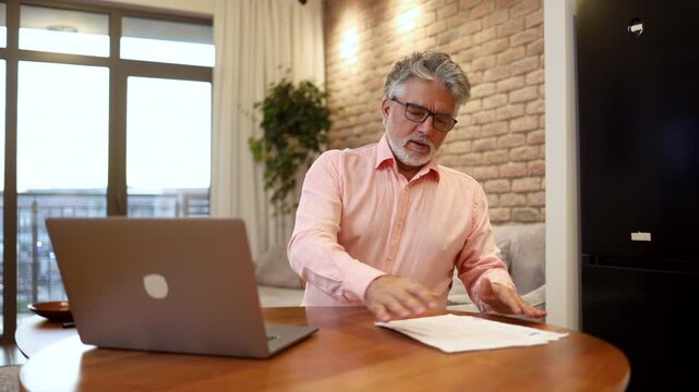 Experienced entrepreneur conducting business from his home office