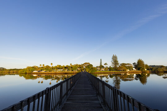 Wooden footbridge leading across Simpsons Creek at Brunswick Heads