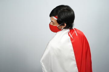 Man in Red and White Cape Wearing a Face Mask - Powered by Adobe