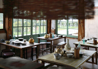 National Folk Museum, Jongno-gu, Seoul, South Korea - September 22, 2022: Interior of Makgeolli(raw rice wine) kettle and tableware on the dining table of old restaurant
