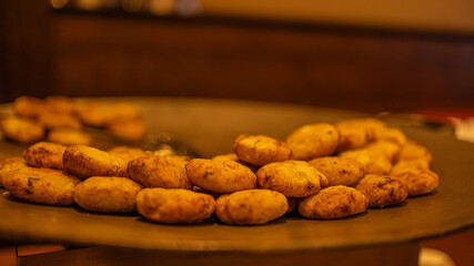 The cutlet in the pan at ceremony hall
