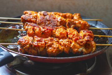 Deliciously Spiced Chicken Tikka Kabab, A Flavourful Grilled Delight with Tangy Marinade and Smoky Charcoal Aroma Serve with Mint and Tomato Chutney. Selective focus. 