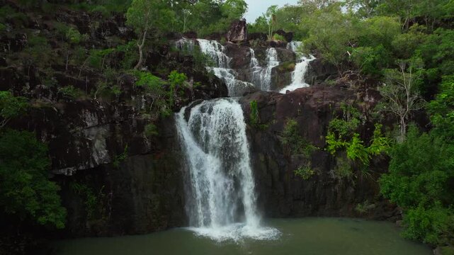 Cedar Creek Falls waterfall rainy season QLD Australia aerial drone view Port of Airlie Beach Whitsundays islands sunny blue sky clouds morning daytime Conway Forest Reserve Palm Grove Proserpine back