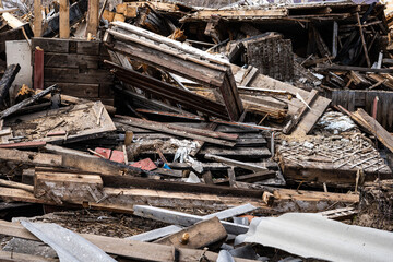 Wooden debris of a destroyed house. 