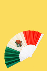 Tricolor fan with the colors of the Mexican flag as a decorative item, the flag of Mexico national to celebrate holidays of Independence Day and Revolution Day