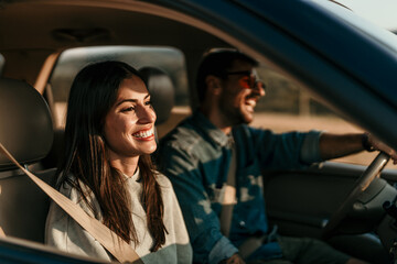 Young couple enjoying the freedom on a Car Trip over a country offroad