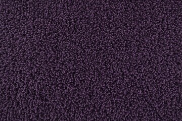 Fototapeta premium close up view of monochrome dark purple carpet texture background for interior, indoor decoration. top view of violet fluffy carpet for modern style decoration. luxury terry cloth texture.
