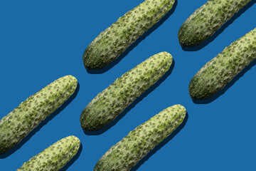 Pattern with a Cucumber on blue background	