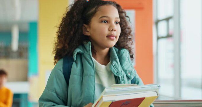 Child, walking and girl with school hallway, books and educational institution with kid for growth. Knowledge development, student and stroll for class, elementary and future or classroom journey