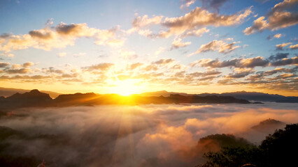 Scenic view dramatic beautiful sunset sky. Natural Sunset Sunrise on meadow silhouette shadow dark land. Vibrant dramatic sky on sunset, dawn, sunrise in Countryside. Landscape Colorful Sky At Sunset