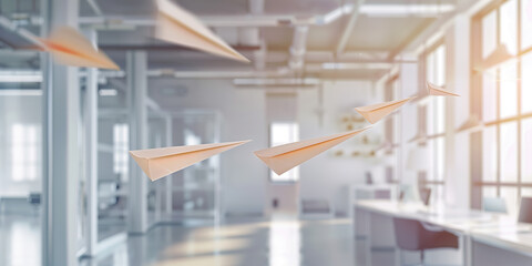 Obraz premium Innovative Business Idea: Paper Airplanes Soaring in Contemporary Office Environment Ideal for Commercial Advertising and Promotional Use