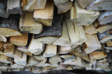 Close-Up of Stacked Firewood Logs Ready for Winter Heating and Woodworking Projects