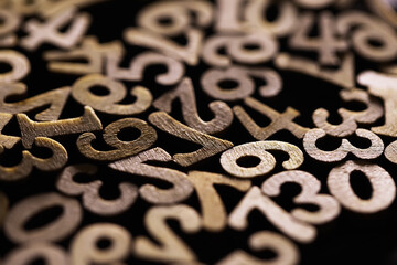 Golden Wooden Numbers Pile: Abstract Background with Mixed Numerical Figures