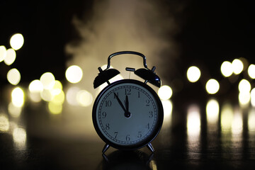 Vintage Alarm Clock at Midnight with Bokeh Lights in Background - Timeless Night Scene