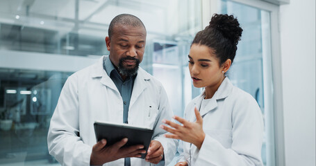 Diversity, results or doctors with tablet, planning or surgeon reading health treatment in hospital. Meeting, research team or online medical advice with clinic app for web consultation or diagnosis