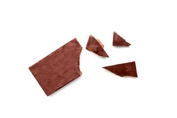 Broken organic milk chocolate bar isolated on a white background from above, top view
