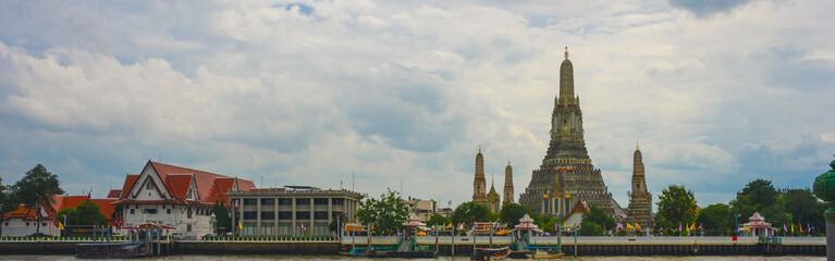 Naklejka premium asia travel concept with old architecture and old pagoda (wat arun) with boat at thailand temple