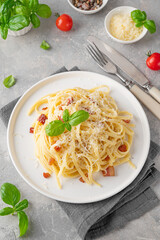 Traditional Italian pasta Carbonara. Spaghetti with bacon, egg and parmesan cheese. Top view, copy space.