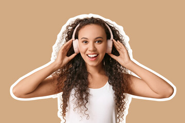 Happy young African-American woman in headphones on beige background