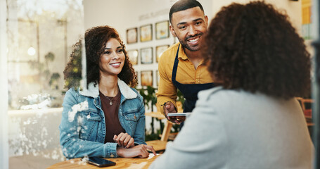 Coffee shop, friends and waiter order with tablet, conversation and customer service at restaurant....