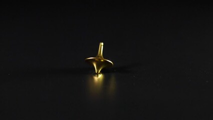 Spinning Gold Top in Motion