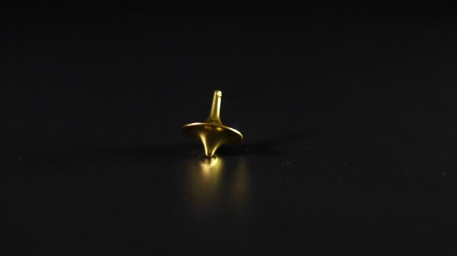 Spinning Gold Top in Motion