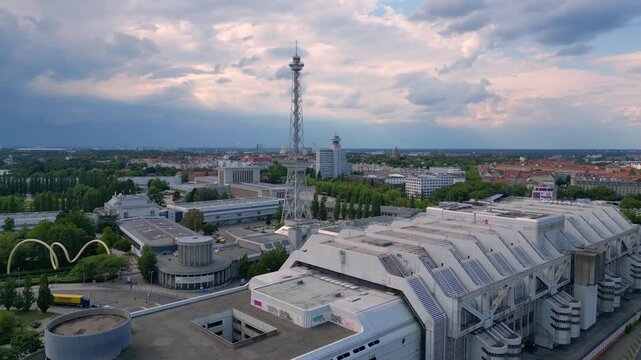 berlin's skyline showcasing the iconic radio tower and exhibition grounds, history and modernity. Fabulous aerial view flight very close passing flight drone