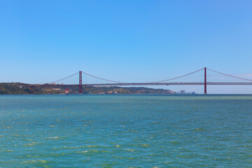 Golden Bridge in Lisbon, Portugal, overlooking the city with stunning views of the Tagus River