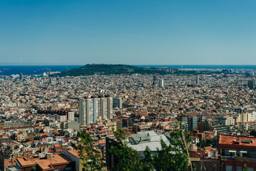  view of the city from the Bunkers del Carmel on a clear sky in Barcelona, Spain - may 2 2024