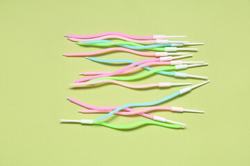 Many colorful Birthday candles on green background