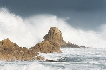 waves crashing on rocks