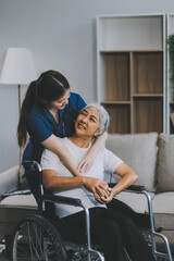 Asian physiotherapist helping elderly woman patient stretching arm during exercise correct with...