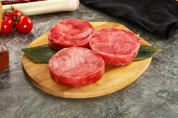 Delicous raw tuna medallion for cooking