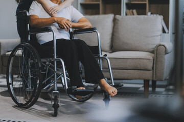 Asian physiotherapist helping elderly woman patient stretching arm during exercise correct with dumbbell in hand during training hand with patient Back problems in garden. Nursing home hospital