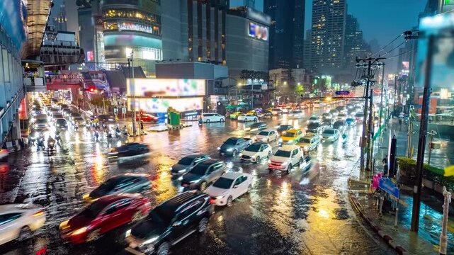 Timelapse video of busy traffic in Bangkok, Thailand in heavy rain at night