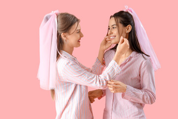 Happy bridesmaids in pajamas on pink background. Hen Party