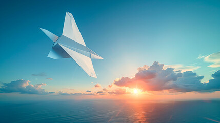 Fototapeta premium Freedom in the Sky - Paper Airplane Soaring Against Vibrant Blue Sky Background
