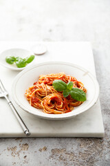 Spaghetti with tomato sauce and basil
