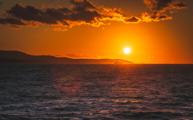 Summer holidays by the sea. Sunset at the beach