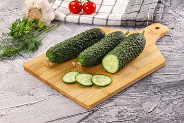 Raw green cucumbers with slices