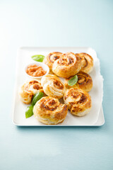Puff pastry swirls with red pesto